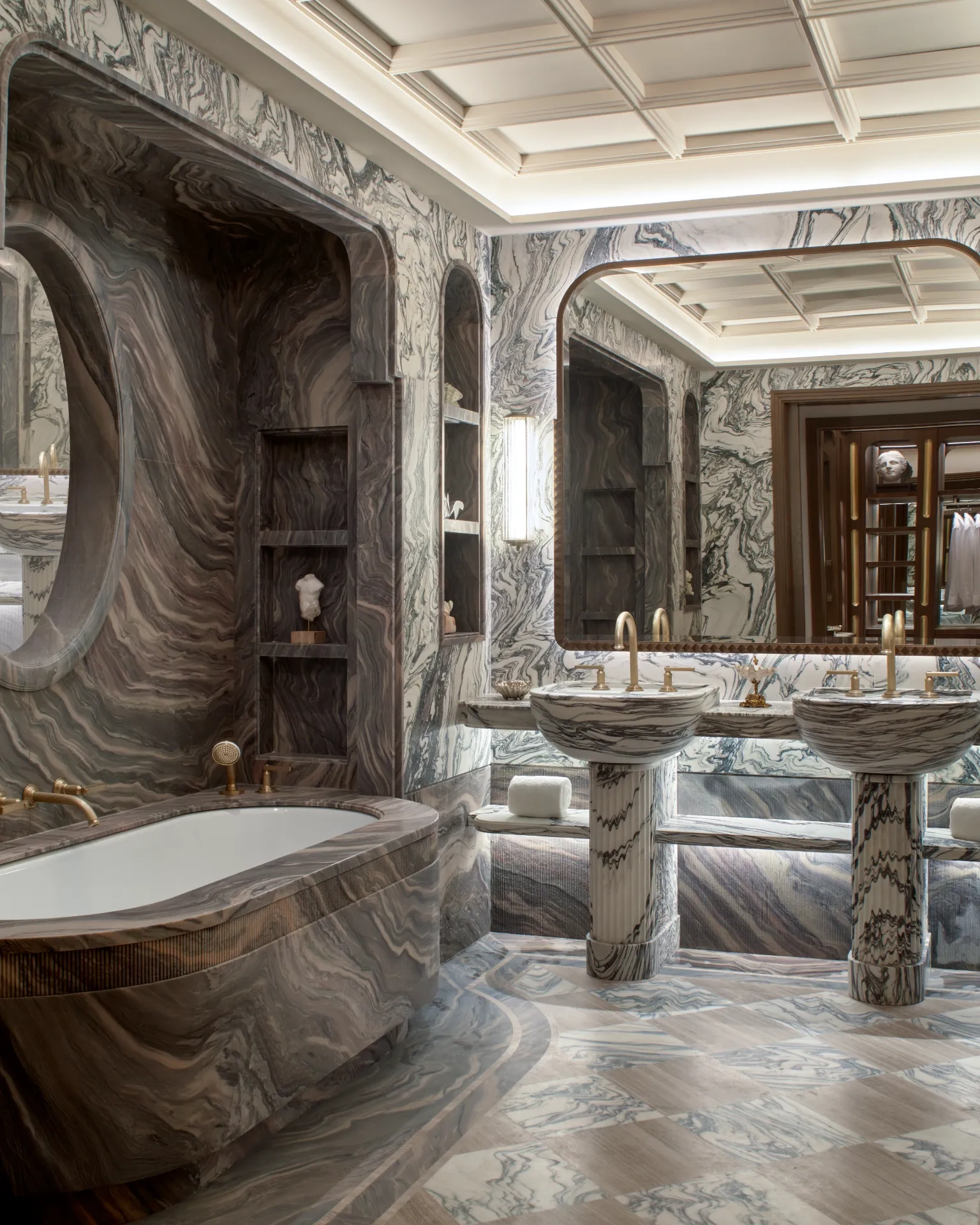 Marble bathrooms in the Orient Express Venezia feature twin sinks and a bathtub